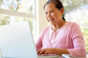older woman working on computer