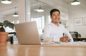 smiling businessman working in office