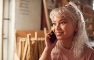 pacific islander woman on phone